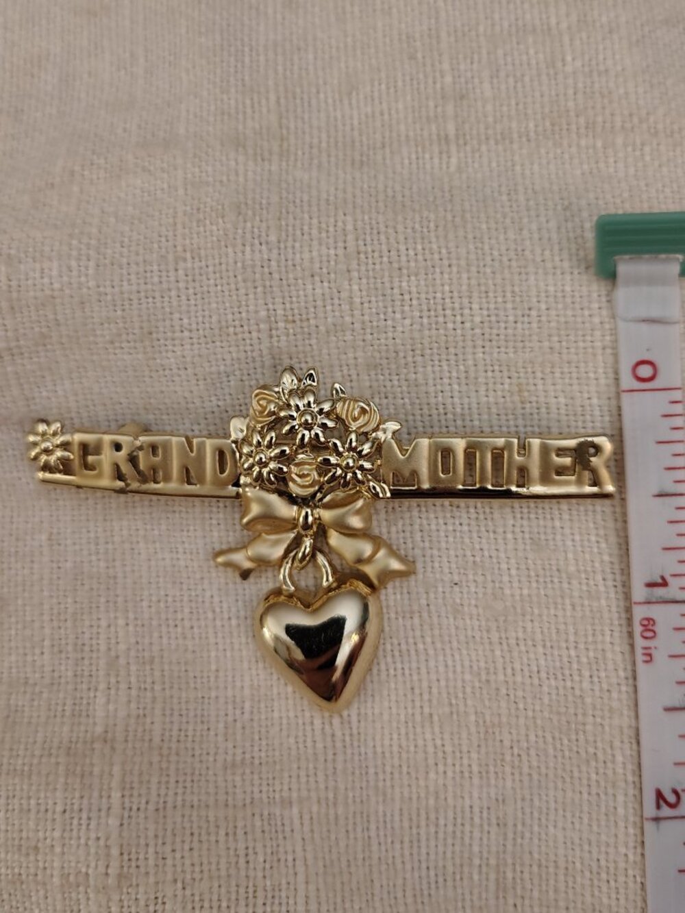 AJC: Grandmother Gold tone Brooch
